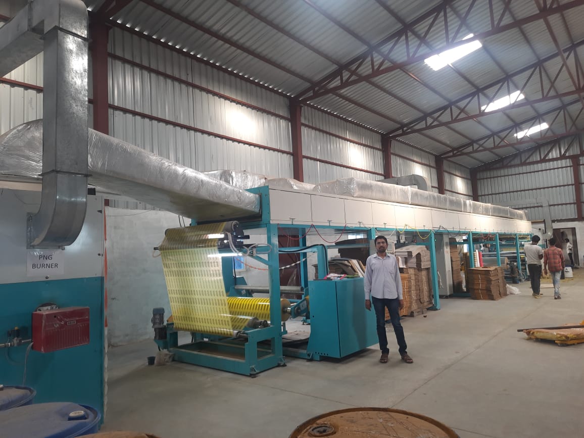 Workers handling adhesive tape production and packing